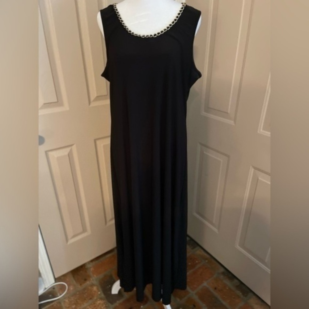 Coco Bianco sleeveless, black sheath dress with gold chain detail